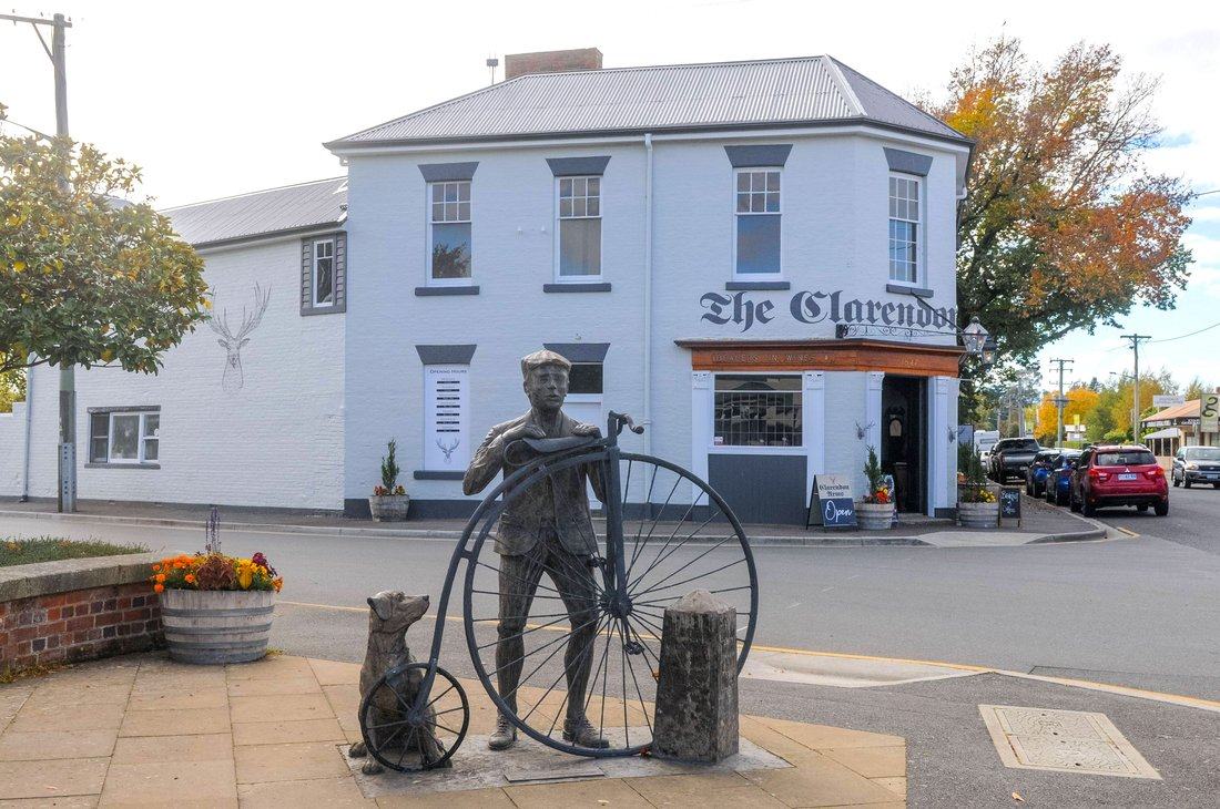 The Clarendon Arms and penny farthing statue, Evandale
